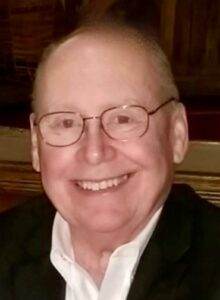 Gentleman smiling, funeral home staff, respectful cremation services, compassionate care, Dogwood Cremations LLC.