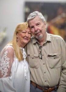 Caring couple at a memorial service, honoring beloved pets with Dogwood Cremations LLC.