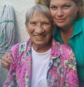 Warm elderly woman smiling, caring support, memorial service, Dogwood Cremations LLC, compassionate cremation services, grief support.