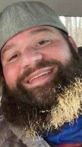 Gentleman with a beard smiling, representing compassionate cremation services by Dogwood Cremations LLC.