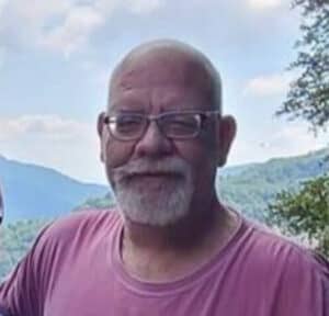 A respectful image of an elderly man outdoors, representing dignity and remembrance for pet cremation services.
